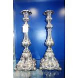 A PAIR OF 19TH CENTURY BAROQUE STYLE SILVER PLATED CANDLESTICKS, 40.5 cm high