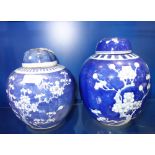 A CHINESE BLUE AND WHITE PRUNUS GINGER JAR, 21 cm high and another similar (2)