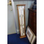 A REPRODUCTION "ADMIRAL FITZROY'S BAROMETER" in an oak case, 97 cm high