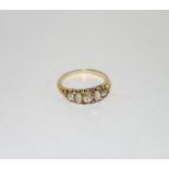 A DIAMOND AND OPAL DRESS RING, on an unmarked yellow metal shank, ring size L