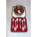 A SET OF SIX SILVER TEASPOONS in a fitted presentation case and a silver coaster with wooden base