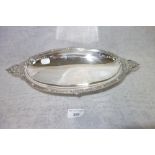 A SILVER OVAL PEDESTAL DISH, with engraved and embossed handles (c. 17.5oz)