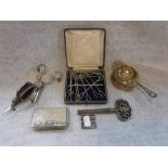 A SILVER TEA-STRAINER AND HOLDER and a collection of sundries