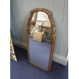 A WILLIAM AND MARY STYLE WALNUT FRAMED WALL MIRROR with shaped top, 40 cms wide, 80 cms high