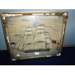 A 19TH CENTURY WOOLWORK of a British sailing ship in full sail, 41 cm high (including frame)