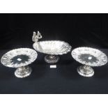 A PAIR OF VICTORIAN SILVER PLATED TAZZAS and a "shell" dish decorated with a squirrel (3)