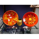 POOLE POTTERY DELPHIS; two red and orange bowls, 27 cm dia. and a vase, 12 cm high