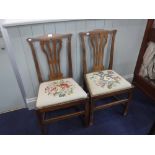 A PAIR OF GEORGE III 'COUNTRY CHIPPENDALE' OAK CHAIRS with needlework upholstered seat