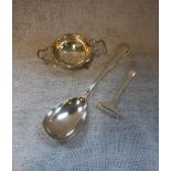 A SILVER SERVING SPOON, a tea-strainer and holder and a baby's food pusher, approx 6.5oz