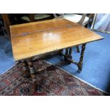 A REPRODUCTION CAROLEAN STYLE WALNUT GATELEG OCCASIONAL TABLE, 61 cms wide