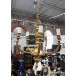 A FIVE BRANCH BRASS CHANDELIER purchased from W Sitch & Co