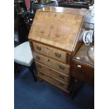 A REPRODUCTION BURR WALNUT BUREAU, 52 cms wide