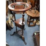 A GEORGE III STYLE MAHOGANY CIRCULAR WASHSTAND on tripod base (some old elements)