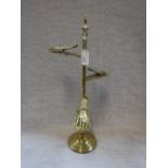 A VICTORIAN BRASS THREE-TIER DESK LETTER CLIP, three sprung hands mounted on a pole