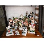 A COLLECTION OF 19TH CENTURY AND SIMILAR STAFFORDSHIRE FIGURES