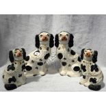 A PAIR OF 19TH CENTURY STAFFORDSHIRE DOGS and a smaller pair