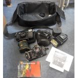 A CHINON CG-5 CAMERA , A CHINON 35-F, and accessories, in a carrying case