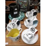 A SUSIE COOPER COFFEE SET decorated with fruit, each cup with different coloured interior, a