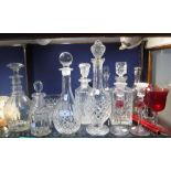 A COLLECTION OF CUT GLASS DECANTERS and similar glassware