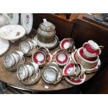 A ROYAL STAFFORD PINK AND GILT DECORATED TEASET and a Noritake teaset