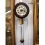 A VICTORIAN POSTMAN'S ALARM CLOCK with a glass painted dial