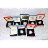 A COLLECTION OF COINS in fitted presentation cases, to include a 'Royal Mint' silver proof one pound