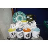 A SUSIE COOPER COFFEE SET decorated with fruit, each cup with different coloured interior, a