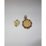 A 9 CT OPEN FACE LOCKET, with scrollwork frame and a heart shaped pendant (2)