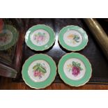 A SET OF FOUR VICTORIAN DESSERT PLATES, each hand painted with a botanical specimen