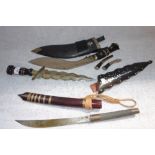 AN EASTERN DAGGER in a leather scabbard, and two others (3)