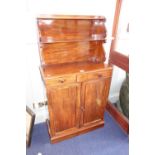 A REGENCY MAHOGANY CHIFFONIER with two tier superstructure with scrolling supports, of small