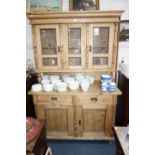 A CONTINENTAL PINE DRESSER, with glazed up-section over cupboards and drawers, 126 cm wide