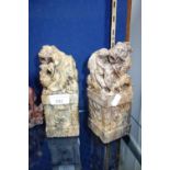 A PAIR OF ORIENTAL CARVED HARDSTONE PLINTHS decorated with dragons, 20 cm high