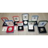 A COLLECTION OF COINS in fitted presentation cases