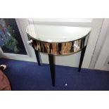 A CONTEMPORARY MIRRORED DEMI LUNE SIDE TABLE, fitted two drawers with glass knobs on ebonised