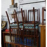 A SET OF FOUR EDWARDIAN SALON CHAIRS, with swag carving, a similar single chair and a pembroke table