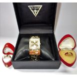 TWO 9 CT YELLOW GOLD DRESS RINGS, and a 'Guess' costume wristwatch in a fitted presentation case (
