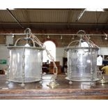 A PAIR OF BRASS HALL LANTERNS with cylinder glass shades, 29 cm high