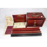 A MAHJONG SET, in a fitted wooden box with brass furniture