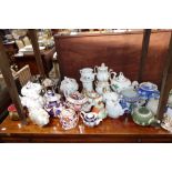 A COLLECTION OF 19TH CENTURY TEAPOTS and others similar