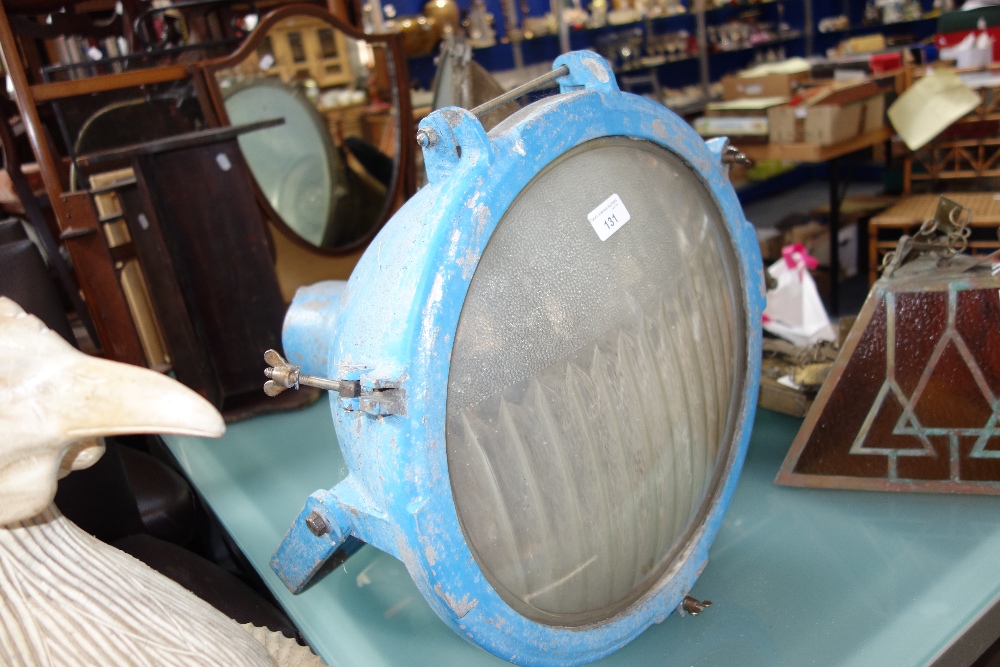 A LARGE VINTAGE SPOTLIGHT, with cast aluminium body (painted blue) on a metal bracket, circa