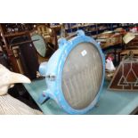 A LARGE VINTAGE SPOTLIGHT, with cast aluminium body (painted blue) on a metal bracket, circa