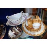 A COLLECTION OF 19TH CENTURY GILT DECORATED TEA CUPS with saucers and similar ceramics