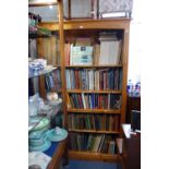 A REPRODUCTION PINE BOOKCASE, 127 cm wide, the shelves 38 cm deep