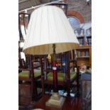 A BRASS CORINTHIAN COLUMN TABLE LAMP, with a red glass pillar, 52 cm high (not incl fitting)