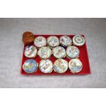 A COLLECTION OF PILL BOXES, decorated with winter and Christmas scenes