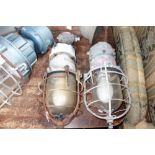 A PAIR OF VINTAGE INDUSTRIAL LIGHTS, with cast aluminium bodies and wire covered domed glass shades,