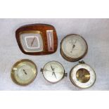 AN ANEROID BAROMETER, the dial inscribed 'T.A. Reynolds Son & Wardale Ltd London', and a