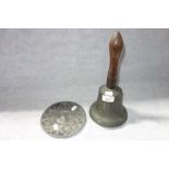 A 19TH CENTURY SCHOOL HAND BELL and a cast metal dish (2)