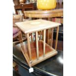 AN EDWARDIAN MAHOGANY TABLE TOP REVOLVING BOOKCASE and a mahogany stationery cabinet